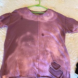 Cute intentionally distressed sweatshirt fits like a large